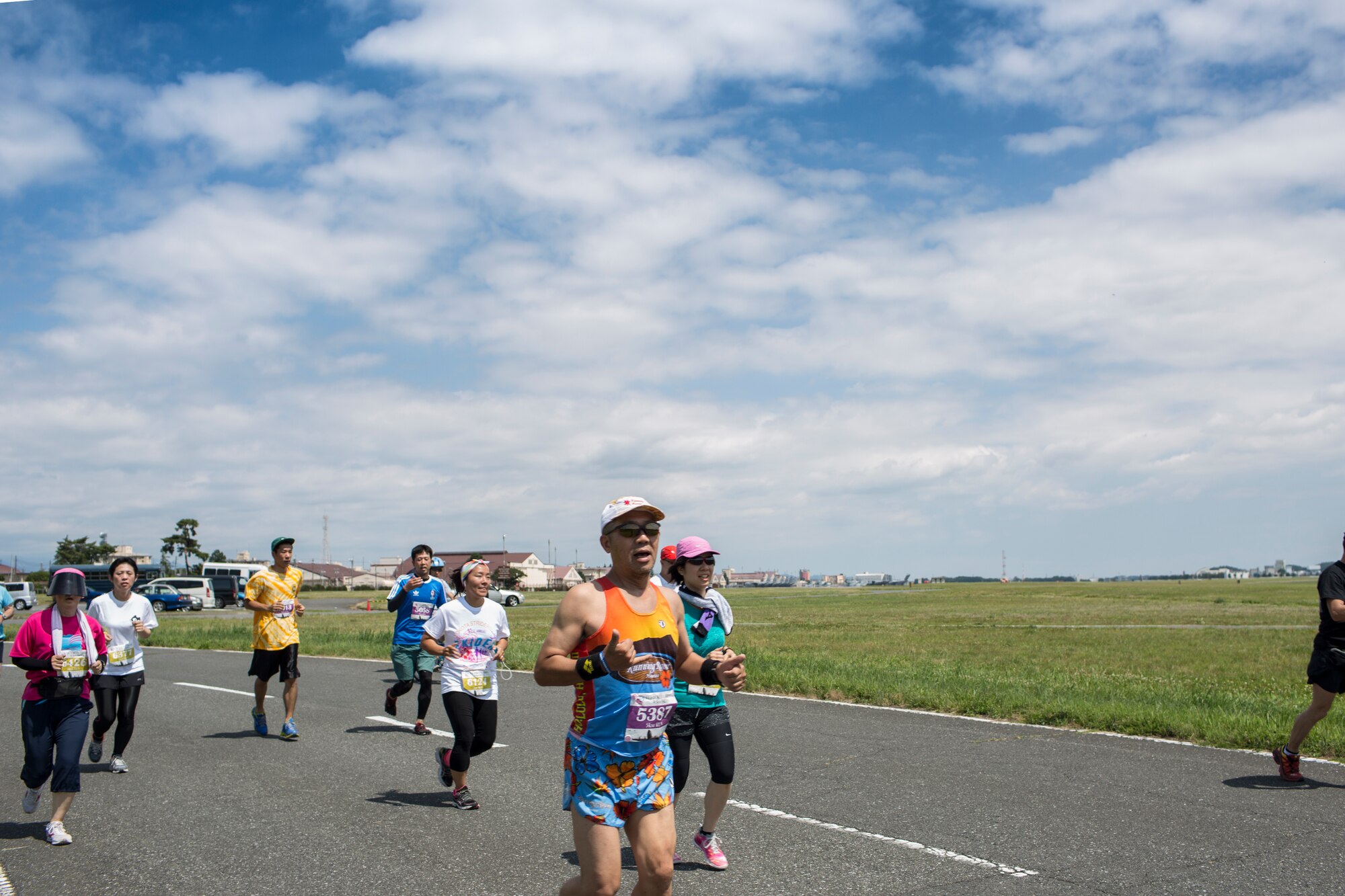 Runners participate in the 31st annual Ekiden Run at Yokota Air Base, Japan, June 7, 2015. The Yokota Striders running club sponsored the annual Ekiden Run consisting of three different races at this event: a 4-person 5k relay, 5k race, and 2k Kid’s Run. (U.S. Air Force photo by Osakabe Yasuo/Released)