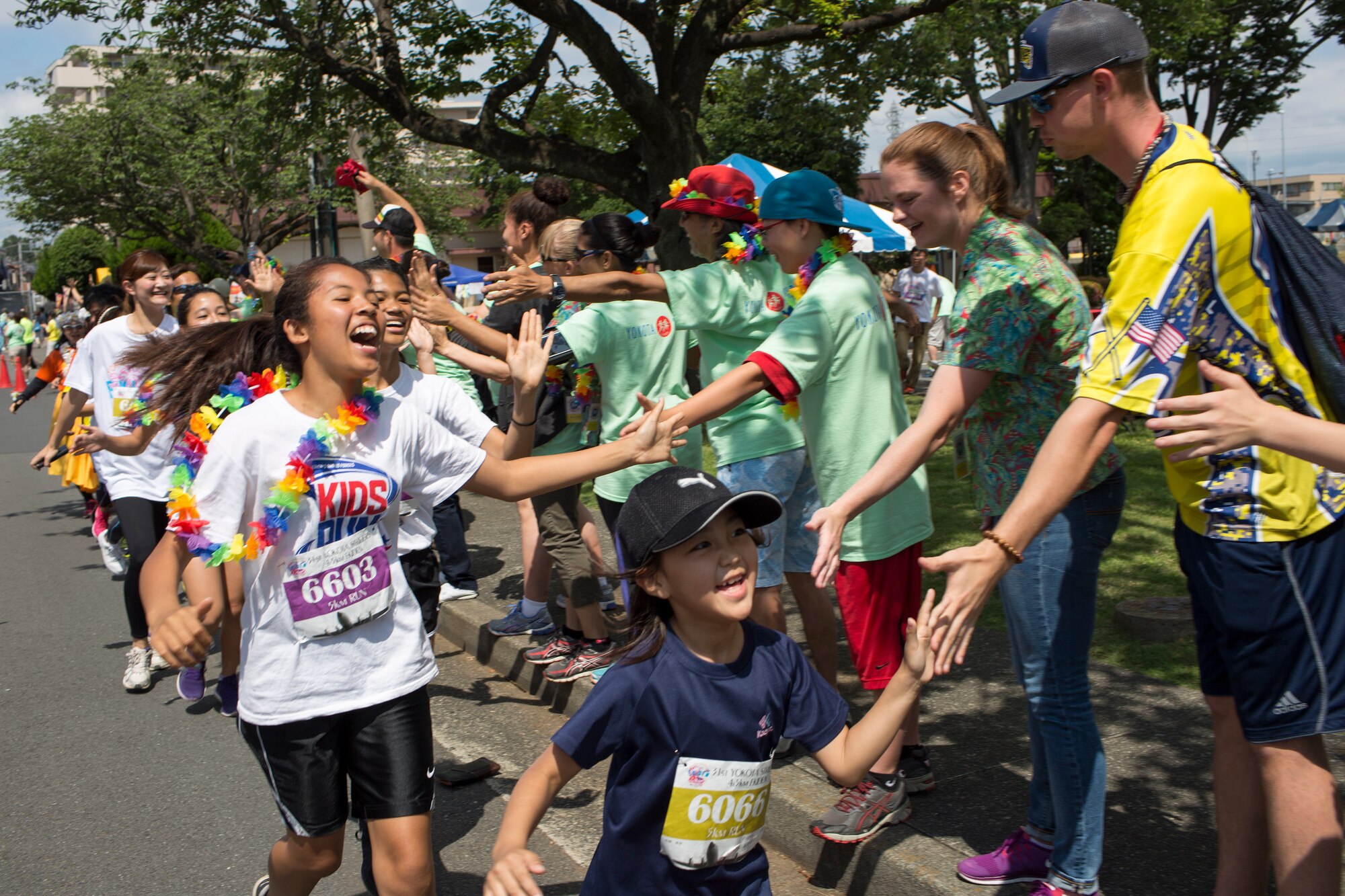 Runners participate in the 31st annual Ekiden 5K Run at Yokota Air Base, Japan, June 7, 2015. The Yokota Striders running club sponsored the annual Ekiden Run consisting of three different races at this event: a 4-person 5k relay, 5k race, and 2k Kid’s Run. (U.S. Air Force photo by Osakabe Yasuo/Released) 