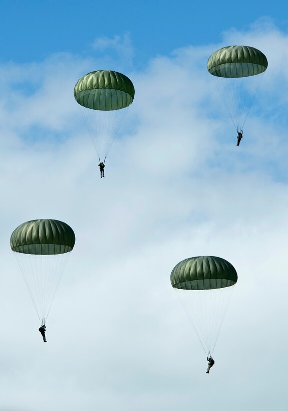 U.S. paratroopers jump over the historic La Fiere drop zone near Sainte ...