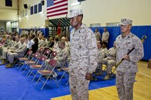U.S. Marine Corps Sgt. Maj. Clifford Wiggins, left, oncoming sergeant major, and Sgt. Maj. Mario Marquez, outgoing sergeant major, Command Element Marine Forces Central Command Forward, prepare to march on to the parade deck at their relief and appointment ceremony aboard Naval Support Activity, Bahrain, June 7, 2015. Wiggins replaced Marquez as sergeant major of the unit. (U.S. Marine Corps photo by Cpl. Sean Searfus CE MARFOR CENTCOM FWD COMCAM/Released)