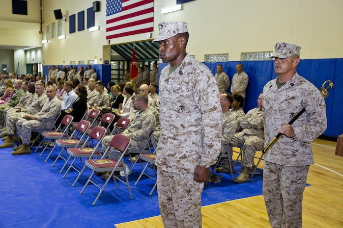 U.S. Marine Corps Sgt. Maj. Clifford Wiggins, left, oncoming sergeant major, and Sgt. Maj. Mario Marquez, outgoing sergeant major, Command Element Marine Forces Central Command Forward, prepare to march on to the parade deck at their relief and appointment ceremony aboard Naval Support Activity, Bahrain, June 7, 2015. Wiggins replaced Marquez as sergeant major of the unit. (U.S. Marine Corps photo by Cpl. Sean Searfus CE MARFOR CENTCOM FWD COMCAM/Released)