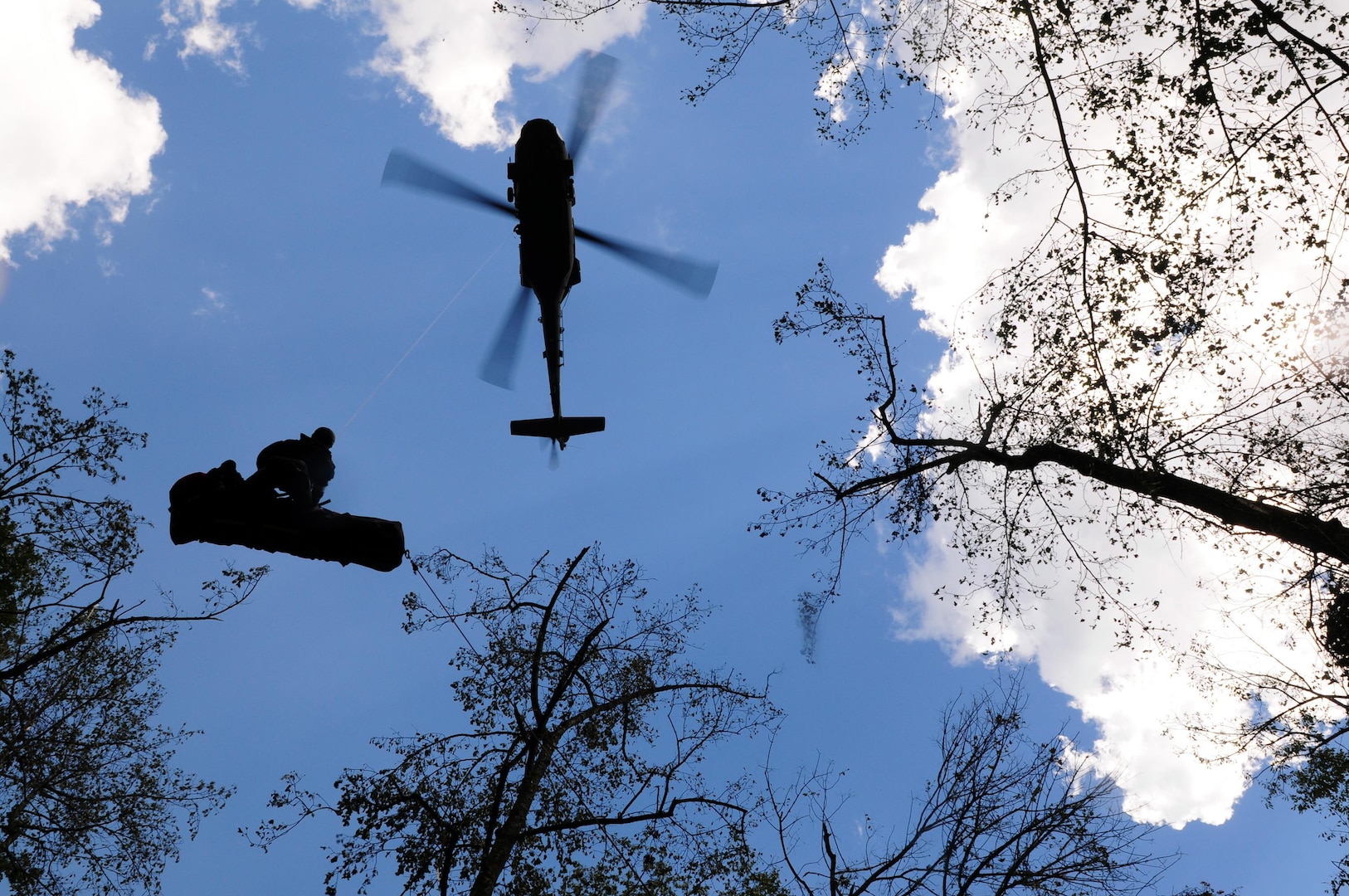 A South Carolina National Guard UH-60 Blackhawk helicopter hovers over a rescue site Feb. 11, 2011. The SC-HART joint operation between civilian first responders and Guardmembers, performed its first live rescue mission since forming in September 2009.