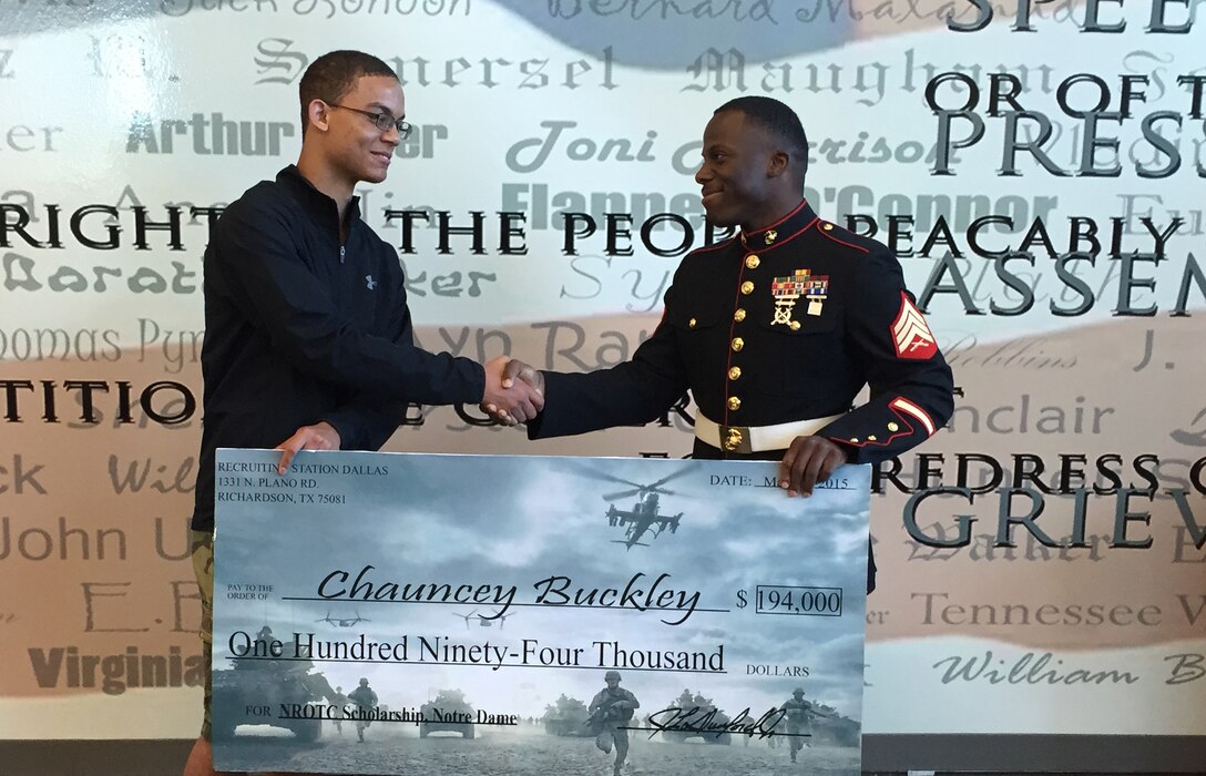 Sgt. Timothy Clark presents Chauncey Buckley with a Naval Reserve Officer
Training Corps Scholarship check during an awards ceremony at Ennis High
School. Selected applicants for the NROTC Scholarship Program are awarded
through a highly competitive national selection process, and receive full
tuition, books stipend, educational fees and other financial benefits at
many of the country's leading colleges and universities. Buckley will be
attending Notre Dame in the Fall. Clark is a recruiter with Recruiting
Station Dallas. (U.S. Marine Corps Photo by Sgt Daniel E. Valle)
