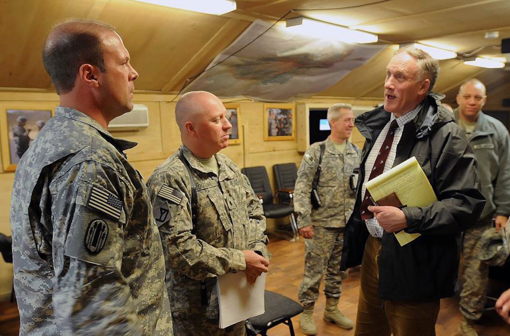 British Parliament member Mr. Julian Brazier, right, visits with Army Lt. Col. Andy Gerlach, left, 196th Maneuver Enhancement Brigade, South Dakota National Guard, and Army Lt. Col. Anthony Couture, 1-181st Infantry Regiment, Massachusetts National Guard, Feb. 22, 2011, at Camp Phoenix, in Kabul, Afghanistan. Brazier met Soldiers from several National Guard states in an effort to help assess the future of Britain's Reserve component by looking at the National Guard model and how it supports operations overseas and domestic operations, professionally develops its servicemembers and provides educational benefits.