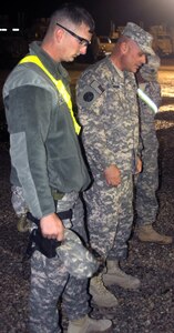 Army 1st Lt. Jock Johnson (middle), chaplain for the 3rd Battalion, 116th Cavalry Regiment, 3rd Sustainment Brigade, 103rd Sustainment Command (Expeditionary) prays with soldiers from A. Company, 3rd Battalion, 116th Cavalry, 3rd Sustainment Brigade, 103rd Sustainment Command (Expeditionary) before a night convoy escort mission.