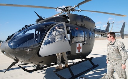 Army Chief Warrant Officers Dino Parmentier and Wayne Griffin, both of the Louisiana National Guard’s State Aviation Command, conduct pre-flight checks on a new LUH-72A light utility medical helicopter at the Army Aviation Support Facility in Hammond, La., Feb. 17, 2011.  The Louisiana National Guard recently received four of the helicopters to help with emergency preparedness and disaster response.