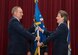 Air Force Chief of Staff Gen. Mark. A. Welsh III passes the Air Force Materiel Command guidon to Gen. Ellen Pawlikowski June 8, 2015, in a change of command ceremony at the Air Force Institute of Technology's Kenney Auditorium on Wright-Patterson Air Force Base, Ohio. (U.S. Air Force photo/Wesley Farnsworth) 