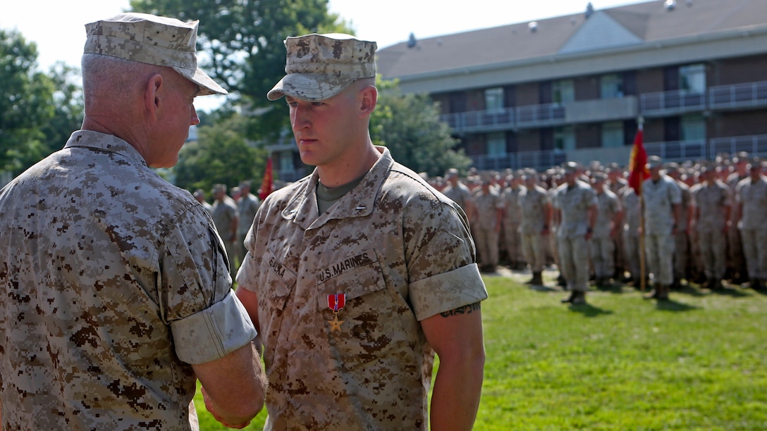 U.S. Marine 1st Lt. James P. Salka (right), the executive officer of Company E, Battalion Landing Team 2/6, 26th Marine Expeditionary Unit, is congratulated by Major Gen. Brian D. Beaudreault (left), the commanding general of 2nd Marine Division, for receiving the Bronze Star Medal during an awards ceremony aboard Marine Corps Base Camp Lejeune, N.C., June 8, 2015. Salka received the Bronze Star Medal with combat distinguishing device for heroic service in connection with combat operations in Afghanistan.