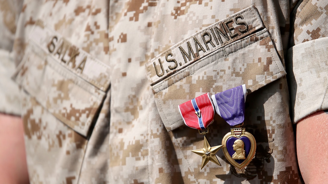U.S. Marine 1st Lt. James P. Salka wears his Bronze Star Medal with combat distinguishing device and Purple Heart after an awards ceremony at Marine Corps Base Camp Lejeune, N.C., June 8, 2015. Salka received the Bronze Star Medal with combat distinguishing device for heroic service in connection with combat operations in Afghanistan.