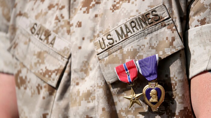 U.S. Marine 1st Lt. James P. Salka wears his Bronze Star Medal with combat distinguishing device and Purple Heart after an awards ceremony at Marine Corps Base Camp Lejeune, N.C., June 8, 2015. Salka received the Bronze Star Medal with combat distinguishing device for heroic service in connection with combat operations in Afghanistan.