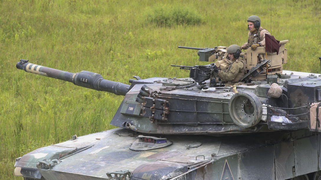 The tank gunner crew representing 2nd Tank Battalion prepares to fire at a target during the 13th annual TIGERCOMP aboard Camp Lejeune, N.C., June 5, 2015. The best tank gunner crews from 1st Tank Battalion, 2nd Tank Battalion and 4th Tank Battalion competed for top honors and the McCard trophy bringing the entire tank community, including tank battalion veterans, together for an entertaining display of the tanks force and powerful capabilities. (U.S. Marine Corps photo by Cpl. Michelle Reif/Released.)