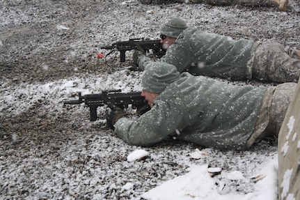 Soldiers from the Texas Army National Guard Agribusiness Development Team-IV qualify on Polish AK-74 5.56 mm Mini-Beryl short assault rifles despite the snowy conditions at Forward Operating Base Ghazni Feb. 6,2011