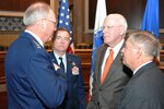 Co-chairs of the Senate National Guard Caucus, Sen. Patrick Leahy of Vermont (right center) and Sen. Lindsey Graham of South Carolina (right) talk with Air Force Gen. Craig McKinley (left), the chief of the National Guard Bureau, and Air Force Maj. Gen. Michael Dubie, the adjutant general for the state of Vermont, after Leahy and Graham spoke to fellow senators and senior leaders of the National Guard, March 3, 2011.