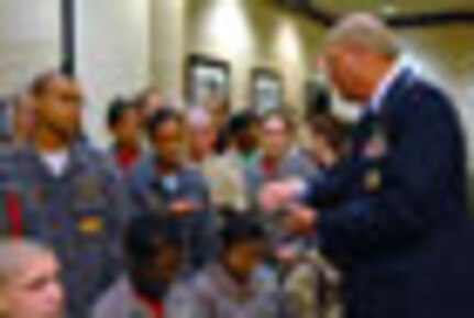 Air Force Gen. Craig McKinley, chief of the National Guard Bureau, gives
every cadet his challenge coin as a keepsake before the National Guard Youth
Foundation's 2011 ChalleNGe Champions Gala in Washington, March 1, 2011.
Unique for this year's gala was the celebration of the program's 100,000th
graduate, cadet Tori Walston, from Louisiana.