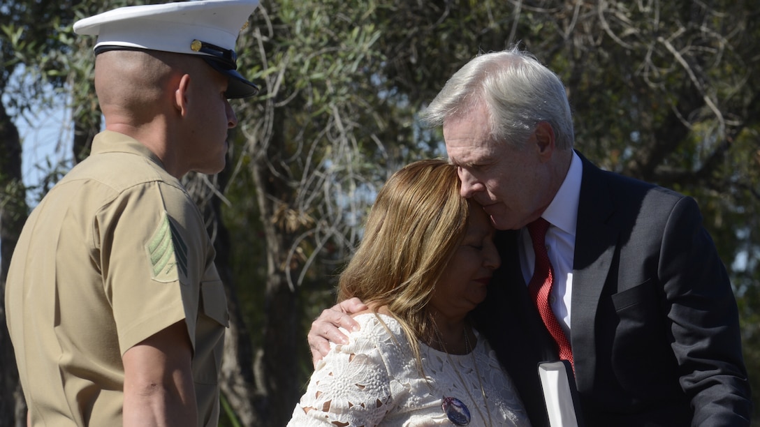 150608-N-AC887-004 CAMP PENDLETON (June 8, 2015) Secretary of the Navy (SECNAV) Ray Mabus comforts the mother of Marine Sgt. Rafael Peralta after presenting her with a Navy Cross, the Navy and Marine Corps' second highest medal for valor during a ceremony at Camp Pendleton. Mabus  posthumously awarded the medal for actions Peralta took in 2004. (U.S. Navy photo by Chief Mass Communication Specialist Sam Shavers/Released)