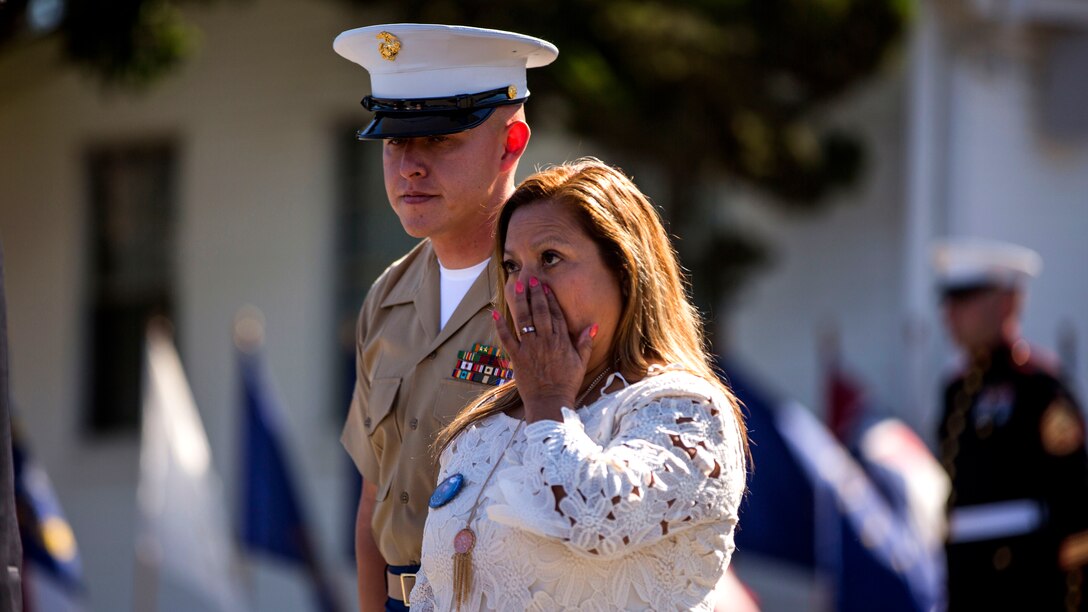 U.S. Marine Sgt. Jamie Andrade, a motor transport operatorwith Headquarters Battalion, 1st Marine Division, and Rosa Peralta, the mother of the late Sgt. Rafael Peralta, attend a Navy Cross Ceremony held in his honor at Marine Corps Base Camp Pendleton, California, June 8, 2015. Peralta was awarded the Navy Cross for his actions in support of Operation Al Fajr in Fallujah, Al Anbar province, Iraq, on Nov. 15, 2004, where he covered an enemy grenade with his body protect his fellow Marines.