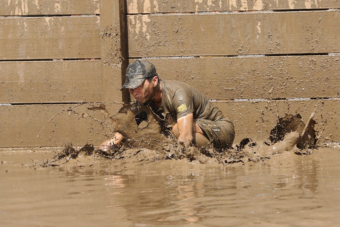 More than 6,000 racers participated in the opening day of the 2015 World Famous Mud Run here, June 6. The Mud Run, open to authorized military and civilian participants, includes a 10k and a 5k option with hills, tire obstacles, river crossings, two 5-foot walls with mud on both sides, a tunnel crawl, a cargo net climb and a final 30-foot long mud pit. The series will also have a 1k kids’ Mud Run for children ages 4 to 12. (Photo by Lance Cpl. Asia Sorenson)