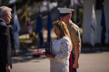 Secretary of the Navy Ray Mabus presents the Navy Cross to Rosa Peralta, the mother of the late Sgt. Rafael Peralta, during ceremony held in his honor aboard Camp Pendleton, Calif., June 8, 2015. Peralta was awarded the Navy Cross for his actions in support of Operation Al Fajr in Fallujah, Al Anbar province, Iraq, on Nov. 15, 2004, where he covered an enemy grenade with his body protect his fellow Marines. (U.S. Marine Corps photo by Lance Cpl. Clarence A. Leake/Released)