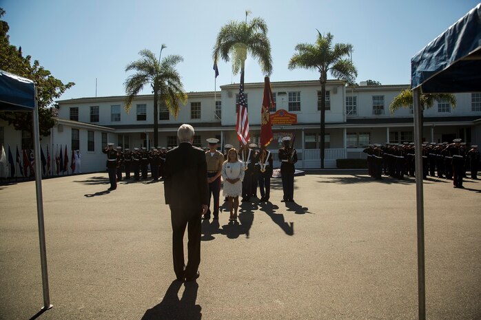 U.S. Marines and Sailors watch as the Secretary of the Navy Ray Mabus presents the Navy Cross to the family members of the late Sgt. Rafael Peralta, aboard Camp Pendleton, Calif., June 8, 2015. Sgt. Rafael Peralta was awarded the Navy Cross posthumously after sacrificing his life by absorbing the blast of an enemy grenade and shielding fellow Marines only feet away while serving with Regimental Combat Team 7, 1st Marine Division in Fallujah, Al Anbar province, Iraq, on Nov. 15, 2004.  (U.S. Marine Corps photo by Sgt. Luis Vega/Released)