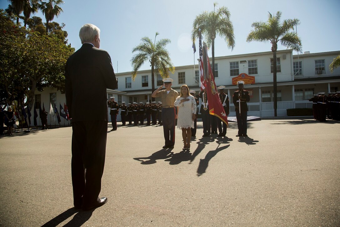 U.S. Marines and Sailors watch as the Secretary of the Navy Ray Mabus presents the Navy Cross to the family members of the late Sgt. Rafael Peralta, aboard Camp Pendleton, Calif., June 8, 2015. Sgt. Rafael Peralta was awarded the Navy Cross posthumously after sacrificing his life by absorbing the blast of an enemy grenade and shielding fellow Marines only feet away while serving with Regimental Combat Team 7, 1st Marine Division, in Fallujah, Al Anbar province, Iraq, on Nov. 15, 2004. (U.S. Marine Corps photo by Sgt. Luis Vega/Released)