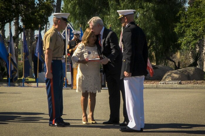 Secretary of the Navy Ray Mabus presents the Navy Cross to Rosa Peralta, the mother of the late Sgt. Rafael Peralta, aboard Camp Pendleton, Calif., June 8, 2015. Sgt. Rafael Peralta was awarded the Navy Cross posthumously after sacrificing his life by absorbing the blast of an enemy grenade and shielding fellow Marines only feet away while serving with Regimental Combat Team 7, 1st Marine Division in Fallujah, Al Anbar province, Iraq, on Nov. 15, 2004. (U.S. Marine Corps photo by Sgt. Donald Holbert/Released)