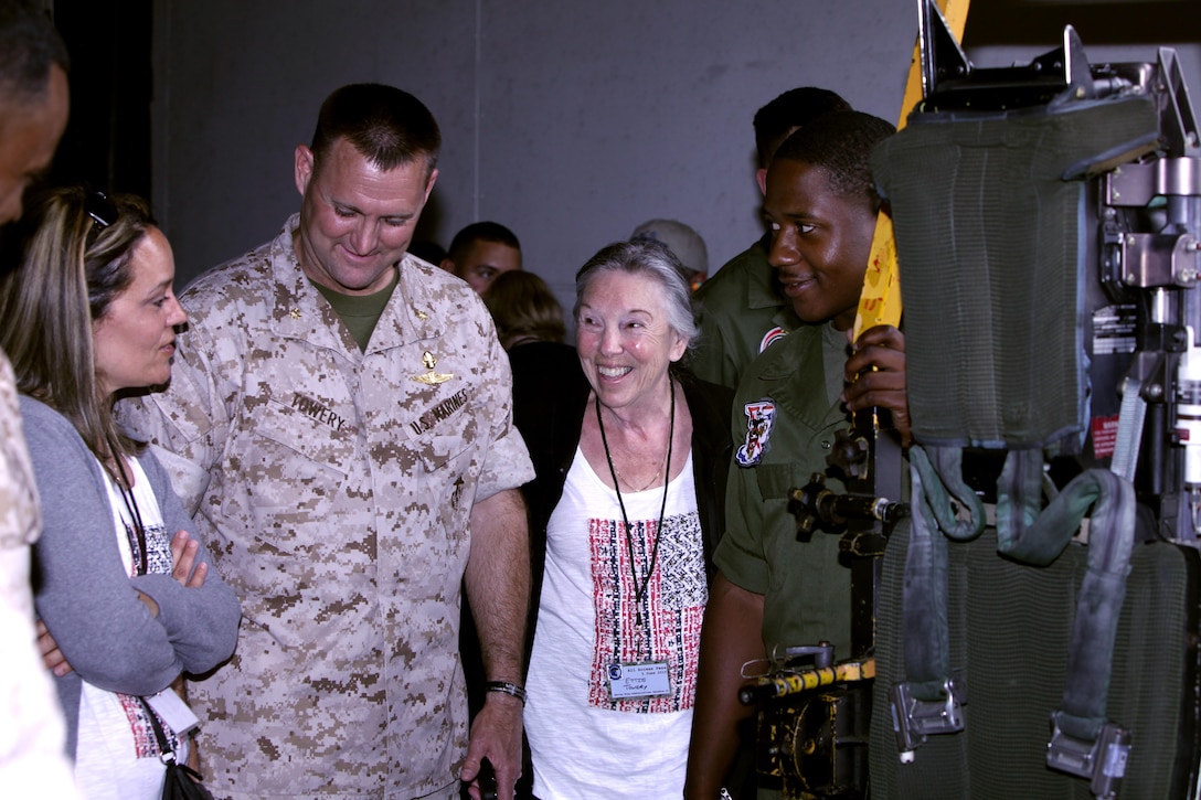 Marines and family members of Marine Wing Communications Squadron 28 learn about an aircraft ejection seat during an “All Access Pass” event at Marine Corps Air Station Cherry Point, N.C., June 5, 2015. MWCS-28 hosted the event to give families an opportunity to see and learn about their Marines’ daily work life, build relationships with the command, meet other families and build camaraderie with the unit and its leadership. 