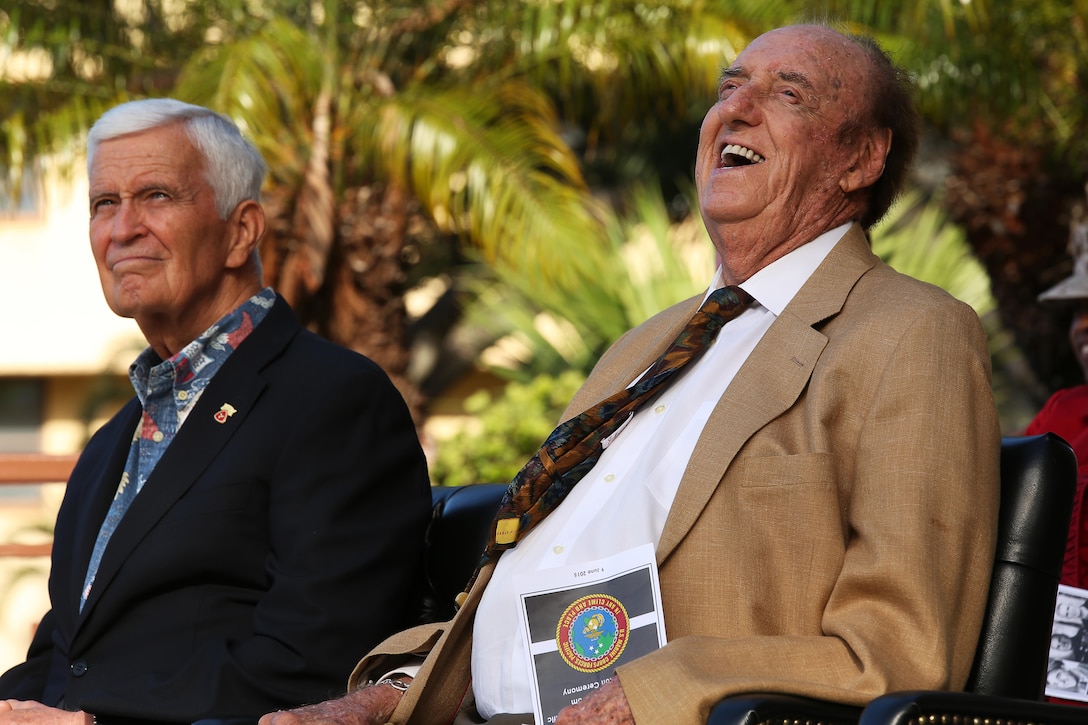 Jim Nabors (right), honorary Marine sergeant who played Gomer Pyle in a television show laughs while his biography is read during a conference room dedication ceremony at Camp H. M. Smith, Hawaii, June 9, 2015. Nabors laughed when his biography stated he was given the rank of private for 37 years before being awarded honorary lance corporal. The ceremony was held to dedicate three conference rooms to be named after Retired Sgt. Maj. Mike D. Mervosh, former Fleet Marine Forces Pacific sergeant major and veteran of World War II, Korea and Vietnam; Retired Lt. Gen. Henry Stackpole III, former MARFORPAC commander; and Nabors. (U.S. Marine Corps photo by Sgt. Sarah Anderson)