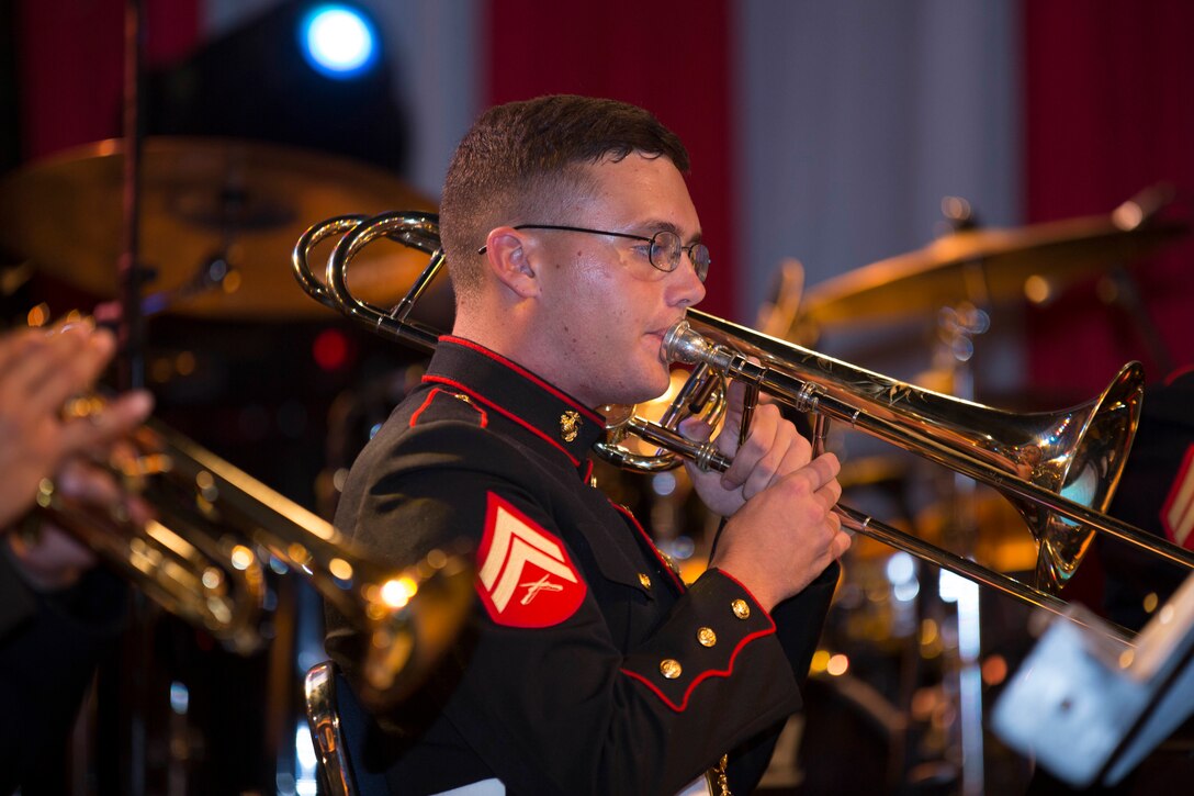Cpl. Mitchem Anderson, a U.S. Marine Corps Forces, Pacific Band Brass Quartet trombone player, performs at the Ambassador's Residence, June 4, 2015. The Brass Quartet performed for U.S. Embassy staff and Indonesian citizens at an Independence Day performance that is being held a month ahead of time due to the upcoming month of Ramadan. This is the first time that the band has played in Indonesia.