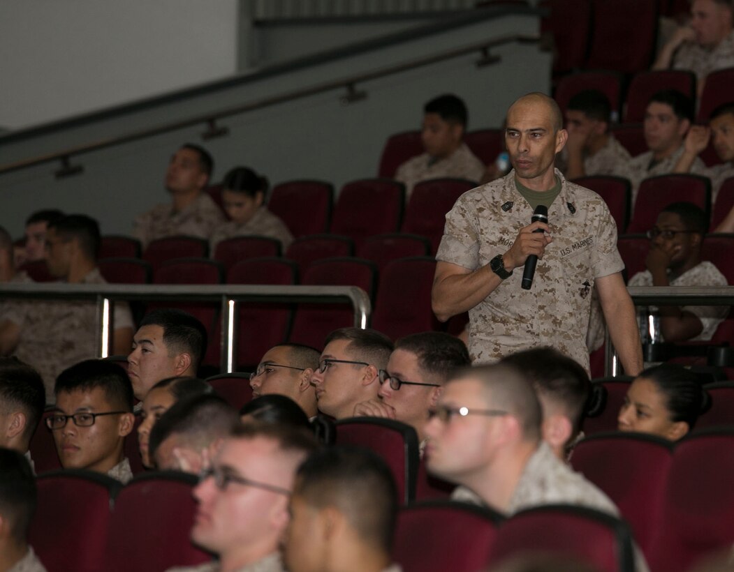 Master Sgt. Patricio Mora directs a segment of the 101 critical days of summer brief June 5 at the base theater on Camp Foster, Okinawa. The “101 critical days of summer”, traditionally observed Memorial Day through Labor Day, is the span of time where statistics show the most accidents and incidents among service members occur. Service members are encouraged to be aware of their own safety while participating in summer activities as well as watching out for the safety of others, according to Mora, the operations training chief with Headquarters & Service Battalion S-3, Marine Corps Installations Pacific-Marine Corps Base Camp Butler, Japan. (U.S. Marine Corps Photo by Cpl. Brittany A. James/Released)

