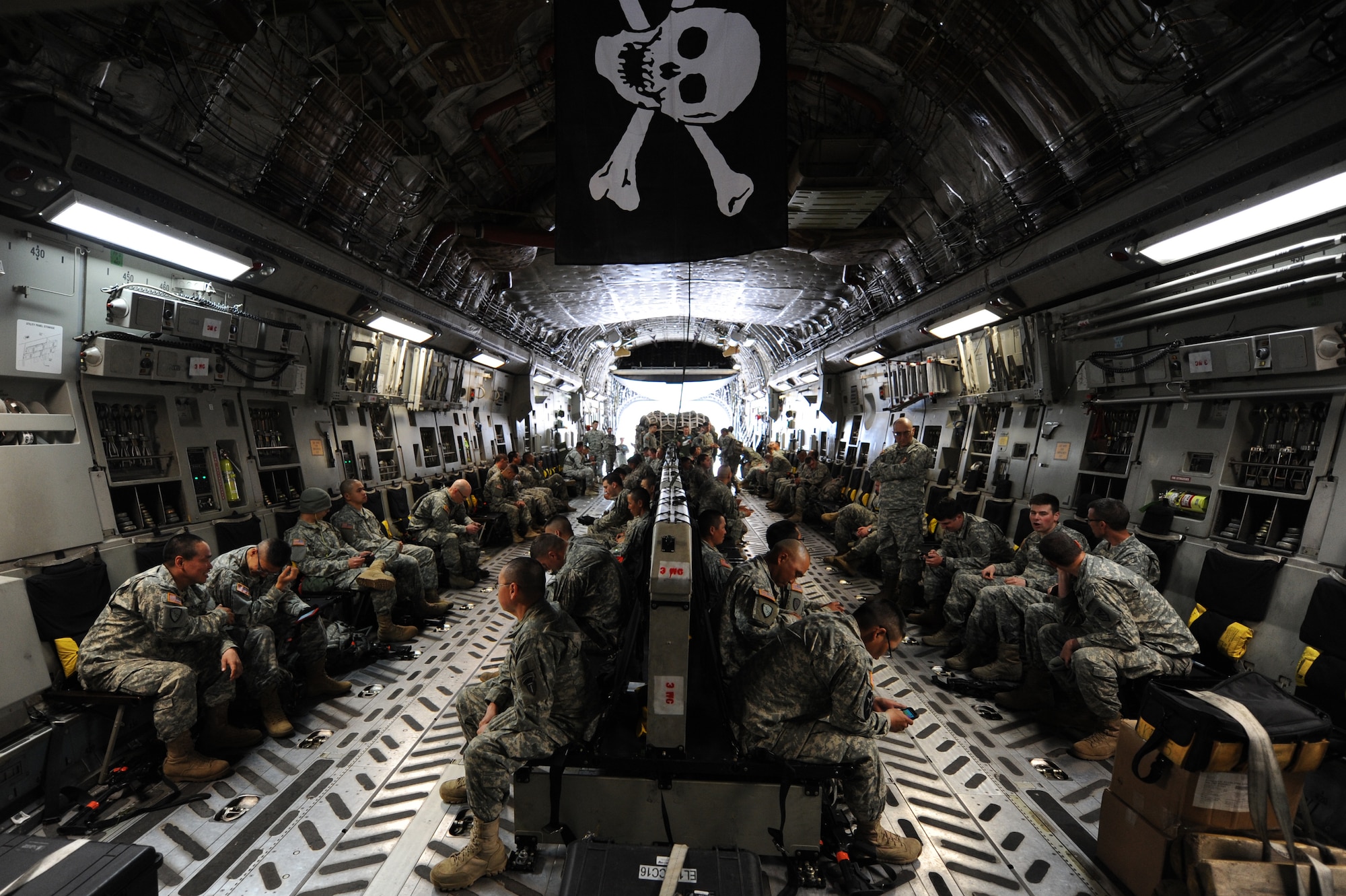 National Guardsmen aboard a C-17 Globemaster III from Joint Base Elmendorf-Richardson, Alaska, prepare for departure in preparation for Golden Coyote at Ellsworth Air Force Base, S.D., June 5, 2015. According to South Dakota National Guard Public Affairs, 35 military units representing 12 states will team up with military members from three foreign nations to create realistic training scenarios simulating contingency operations both at home station and abroad. (U.S. Air Force photo by Airman 1st Class James Miller/Released) 