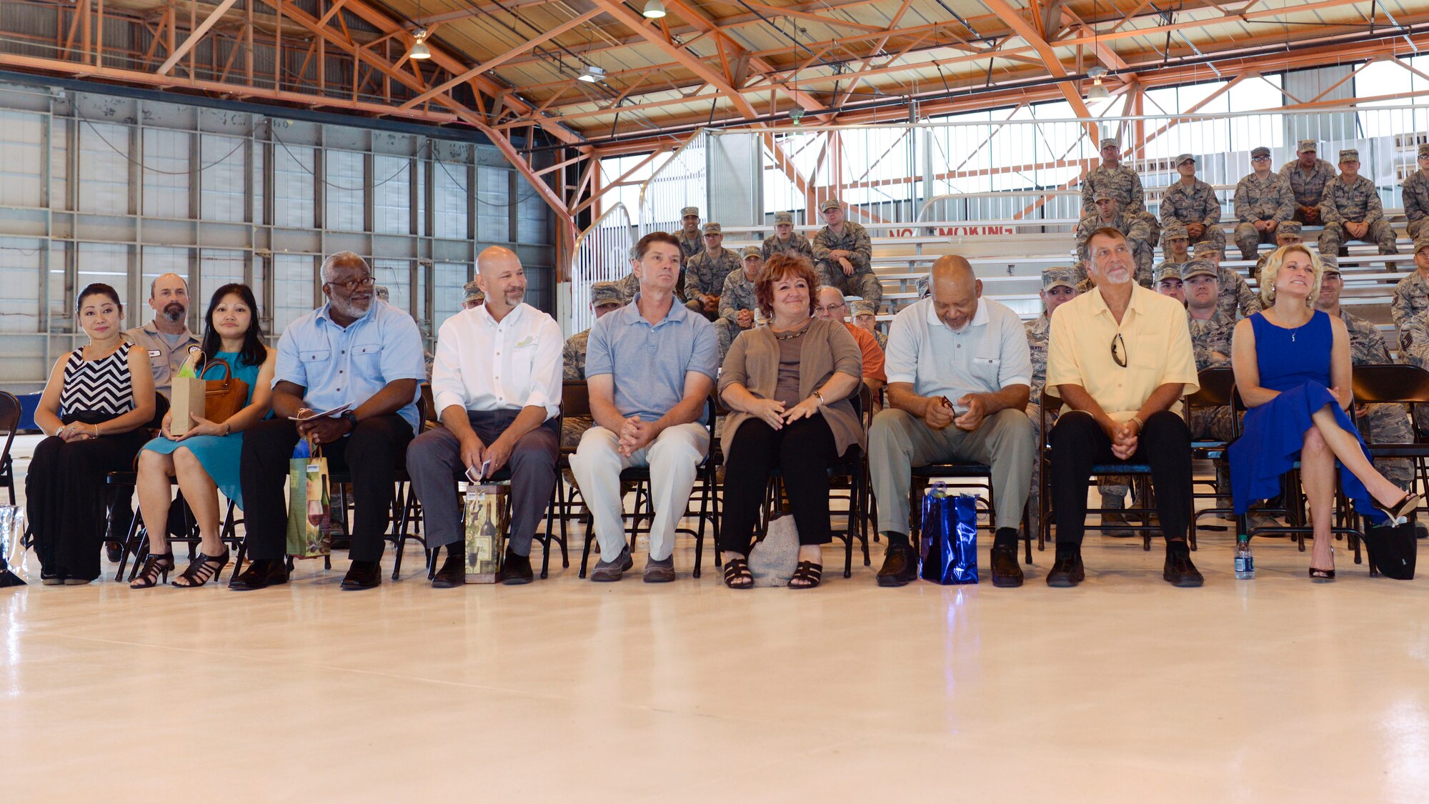 Family and friends of Maj. Jeurney K. Meekins, the 49th Aircraft Maintenance Squadron outgoing commander, and Maj. Rebecca A. Hart, the 49th AMXS incoming commander, are recognized during the 49th AMXS Change of Command at Holloman Air Force Base, N.M. June 9, 2015. During the Change of Command, Col. Michael Shea, the 49th Maintenance Group commander was the presiding officer and Maj. Rebecca A. Hart, the 49th AMXS incoming commander, assumed command. The 49th AMXS has 359 assigned Airmen to maintain nine MQ-1B Predator remotely piloted aircraft in support of the 6th Reconnaissance Squadron, 22 MQ-9A Reaper remotely piloted aircraft in support of the 9th and 29th Attack Squadrons and 11 ground control stations and associated satellite communications assets that encompass command and control capability for the aircraft. (U.S. Air Force photo by Staff Sgt. E’Lysia A. Wray/Released)