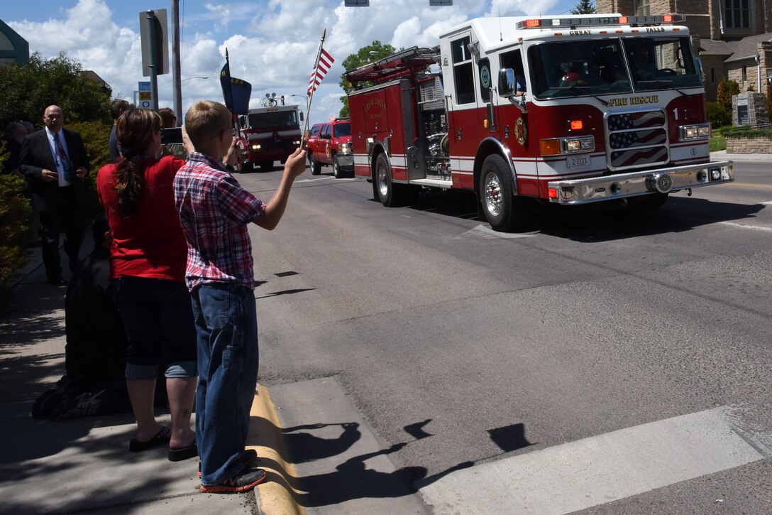 Airmen and their families from Malmstrom Air Force Base lined the 10th Ave. South Bridge out of Great Falls and rendered a final salute to honor the service and sacrifice of the veterans, who were transferred and laid to rest in Montana State Cemetery at Fort Harrison in Helena, Montana.  (U.S. Air Force photo/Chris Willis)