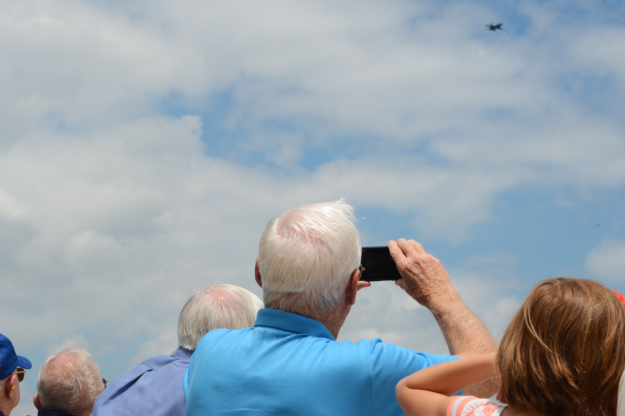 A retired U.S. Air Force Wild Weasel takes a photo of the 20th Fighter Wing Viper Demo Team at Shaw Air Force Base, S.C., June 5, 2015. The Wild Weasels were given the opportunity to watch the Viper Demo Team in action over the skies of Shaw during their tour at the base. (U.S. Air Force photo by Senior Airman Jonathan Bass/Released)