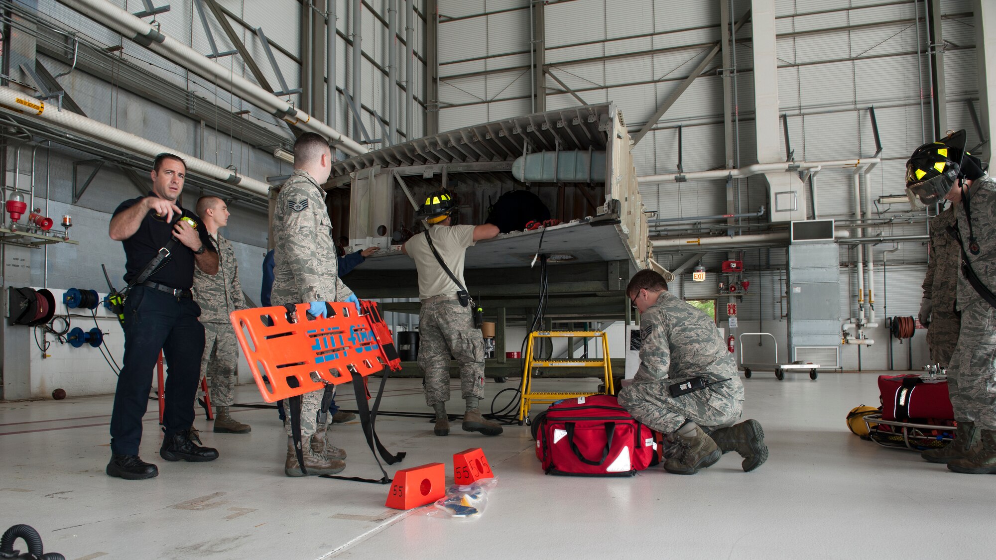 Airmen and personnel from the 436th Civil Engineer and 436th Medical Operations Squadrons respond to an in-wing fuel cell extraction exercise June 8, 2015, at Dover Air Force Base, Del. These Airmen and personnel are required to conduct this exercise annually. (U.S. Air Force photo/Airman 1st Class Zachary Cacicia)
