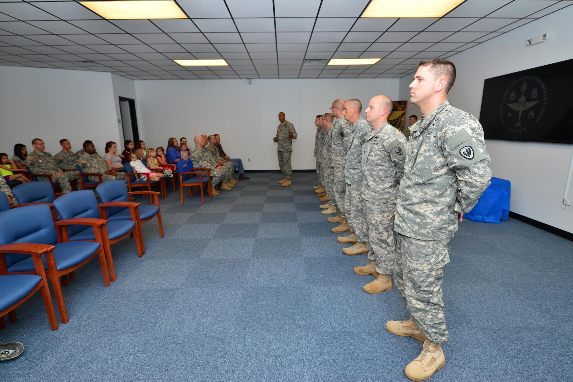 U.S. Army Command Sgt. Maj. Lloyd G. Morant, center, Aviation Logistics Noncommissioned Officer Academy commandant, speaks about awardees during an Army Instructor Badge ceremony at Fort Eustis, Va., June 5, 2015. Training and Doctrine Command created the badge to recognize steps instructors take to reach higher levels of instructor development. (U.S. Air Force photo by Staff Sgt. Natasha Stannard/Released)