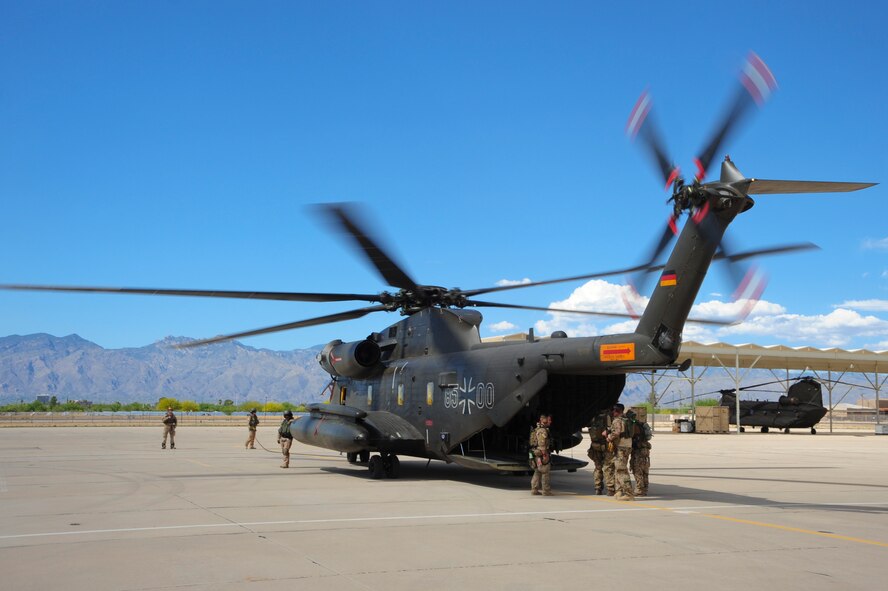 The blades of German Air Force CH-53GS begin to spin before being boarded by German and U.S. Air Force pararescuemen during Angel Thunder 2015 at Davis-Monthan Air Force Base, Ariz., June 7, 2015.  Angel Thunder is the world's largest personnel recovery exercise.  D-M hosted 11 partner nations and nine interagencies with a common goal to train personnel recovery forces to prepare, plan, execute and adapt for rescue missions.  (U.S. Air Force photo by Airman 1st Class Chris Massey/Released)