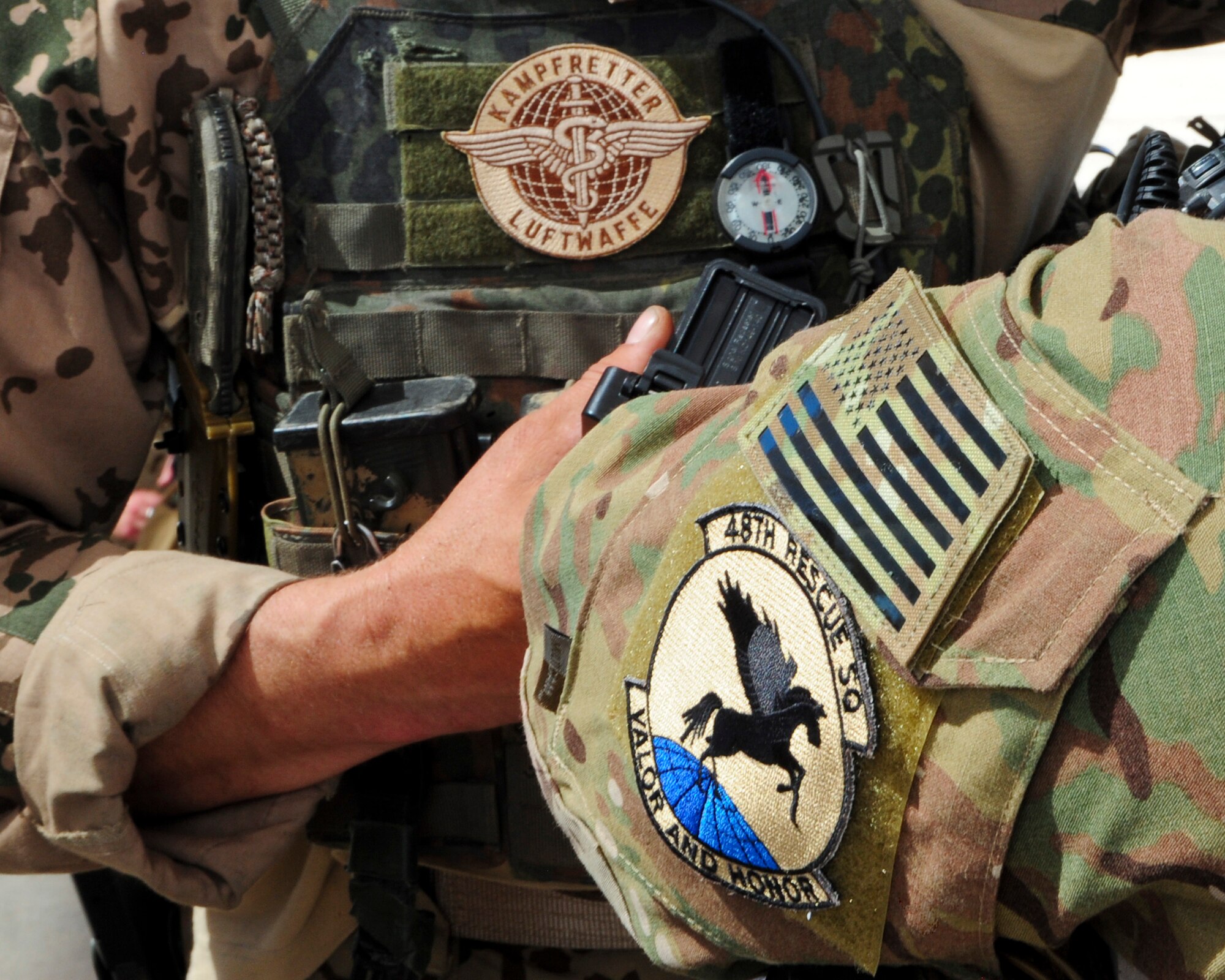 German Air Force pararescue and U.S. Air Force 48th Rescue Squadron Pararescue patches are worn by pararescuemen working together during Angel Thunder 2015 at Davis-Monthan Air Force Base, Ariz., June 7, 2015.  Angel Thunder is an Air Combat Command sponsored personnel recovery exercise for combat air force, joint, allied and interagency participants to come together and increase their knowledge about various recovery techniques. (U.S. Air Force photo by Airman 1st Class Chris Massey/Released)