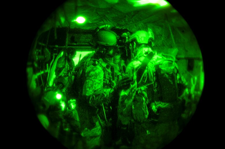 German Air Force pararescuemen prepare their gear while flying over Southern California in a German Air Force CH-53GS helicopter during Angel Thunder 2015 June 7, 2015.  Angel Thunder is the world's largest personnel recovery exercise.  D-M hosted 11 partner nations and nine interagencies with a common goal to train personnel recovery forces to prepare, plan, execute and adapt for rescue missions.  (U.S. Air Force photo by Airman 1st Class Chris Massey/Released)