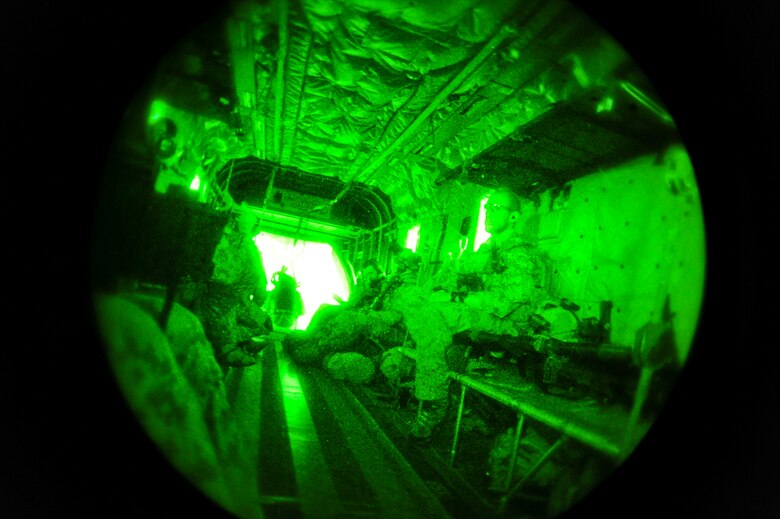 German Air Force pararescuemen sit aboard a German Air Force CH-53GS helicopter while flying over Southern California during Angel Thunder 2015, June 7, 2015.  Angel Thunder is the world's largest personnel recovery exercise.  D-M hosted 11 partner nations and nine interagencies with a common goal to train personnel recovery forces to prepare, plan, execute and adapt for rescue missions.  (U.S. Air Force photo by Airman 1st Class Chris Massey/Released)