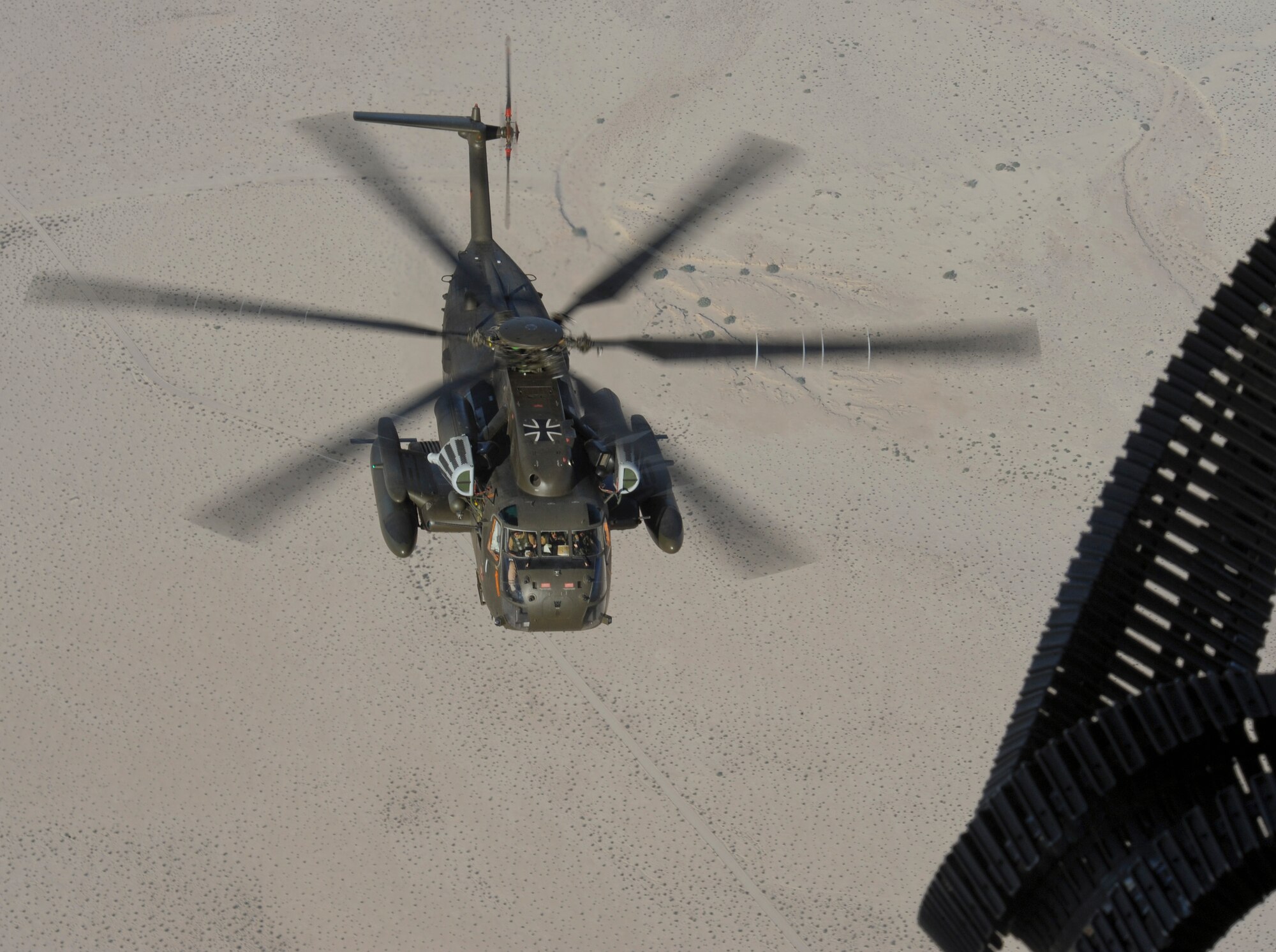 A German Air Force CH-53GS flies over southern Arizona during Angel Thunder 2015, June 7, 2015.  Angel Thunder is the world's largest personnel recovery exercise.  D-M hosted 11 partner nations and nine interagencies with a common goal to train personnel recovery forces to prepare, plan, execute and adapt for rescue missions.   (U.S. Air Force photo by Airman 1st Class Chris Massey/Released)