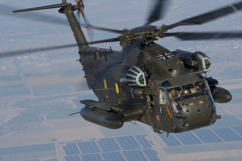 A German Air Force CH-53GS flies over southern Arizona during Angel Thunder 2015 June 7, 2015.  Angel Thunder is the largest personnel recovery exercise in the world combining joint, coalition and interagency personnel. Participants train through the full spectrum of personnel recovery capabilities with numerous types of aircraft.  (U.S. Air Force photo by Airman 1st Class Chris Massey/Released)