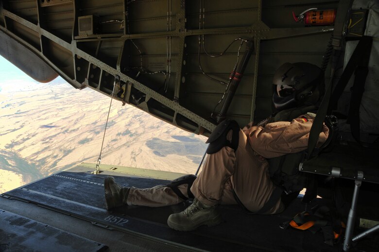 A German Air Force aerial gunner sits on the ramp of a German Air Force CH-53GS helicopter while flying over southern Arizona during Angel Thunder 2015 June 7, 2015.  Angel Thunder is the world's largest personnel recovery exercise.  D-M hosted 11 partner nations and nine interagencies with a common goal to train personnel recovery forces to prepare, plan, execute and adapt for rescue missions.   (U.S. Air Force photo by Airman 1st Class Chris Massey/Released)