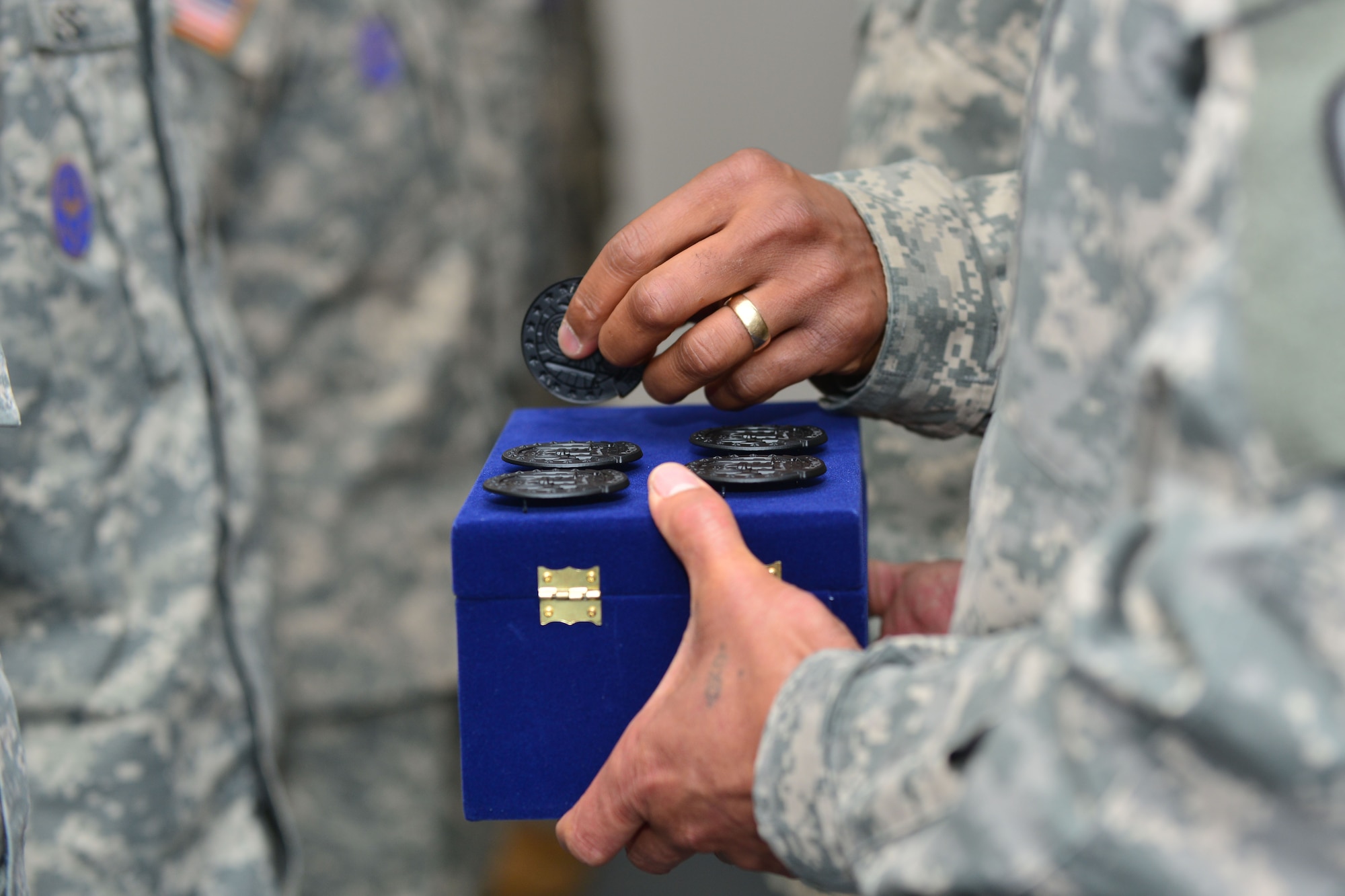 U.S. Army Command Sgt. Maj. Lloyd G. Morant, Aviation Logistics Noncommissioned Officer Academy commandant, awards seven of his instructors the Army Instructor Badge at Fort Eustis, Va., June 5, 2015. The instructors earned the badge by completing 80 hours of professional military education for instructors. (U.S. Air Force photo by Staff Sgt. Natasha Stannard/Released)