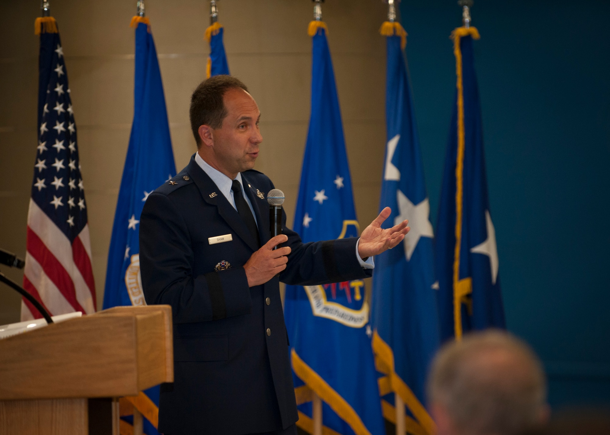 PETERSON AIR FORCE BASE, Colo. – Newly promoted Brig. Gen. John Shaw, 21st Space Wing commander, addresses everyone who came to support him at his promotion ceremony at the Peterson Air and Space Museum, June 5, 2015. Shaw took command of the 21st Space Wing July 26, 2013 and will move on to Offutt Air Force Base, Nebraska, June 12 as deputy director for U.S. Strategic Command. (U.S. Air Force photo by Airman 1st Class Rose Gudex)