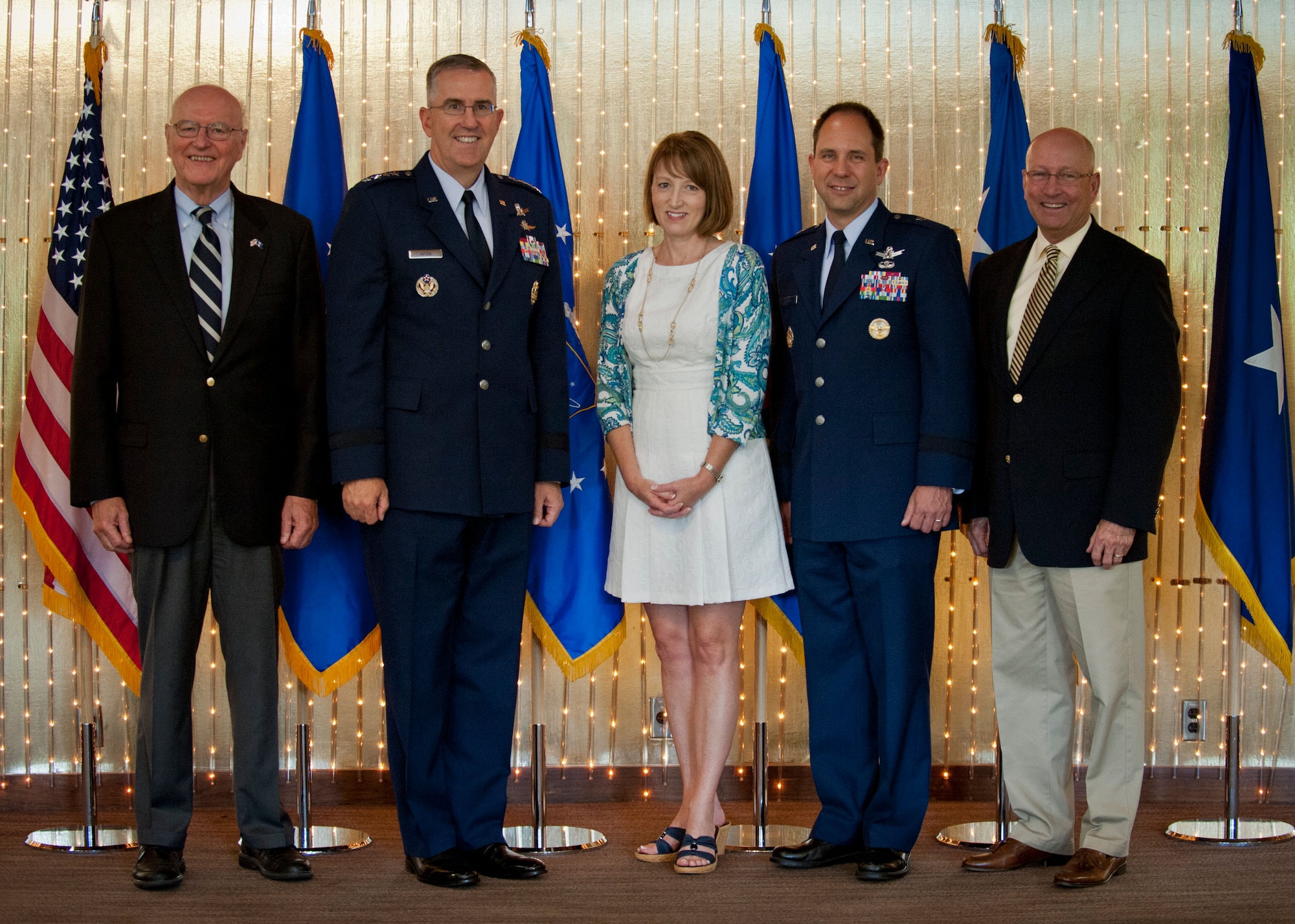 PETERSON AIR FORCE BASE, Colo. – (from left to right) Retired Gen. Gene Renaurt, , Gen. John Hyten, Air Force Space Command commander, Tonia Shaw, Brig. Gen John Shaw, 21st Space Wing commander, and Mr. Peter Teets, former Undersecretary of the Air Force, pose for a photo at The Club following Brig. Gen. Shaw’s promotion ceremony at the Peterson Air and Space Museum  June 5. Shaw took command of the 21st Space Wing July 26, 2013 and will move on to Offutt Air Force Base, Neb., June 12 as deputy director for U.S. Strategic Command. (U.S. Air Force photo/Staff Sgt. J. Aaron Breeden)