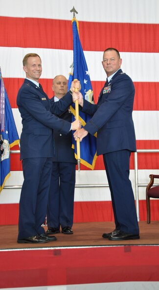 Col. James "Jimbo" Macaulay took command of the 442d Fighter Wing Operations Group from Brig. Gen. Hubert "Hubie" Hegtvedt, 442d FW commander, at a change of command ceremony here June 7. Macaulay supervises flying operations for 27 A-10 Thunderbolt II aircraft. (Photo by Capt. Denise Haeussler)