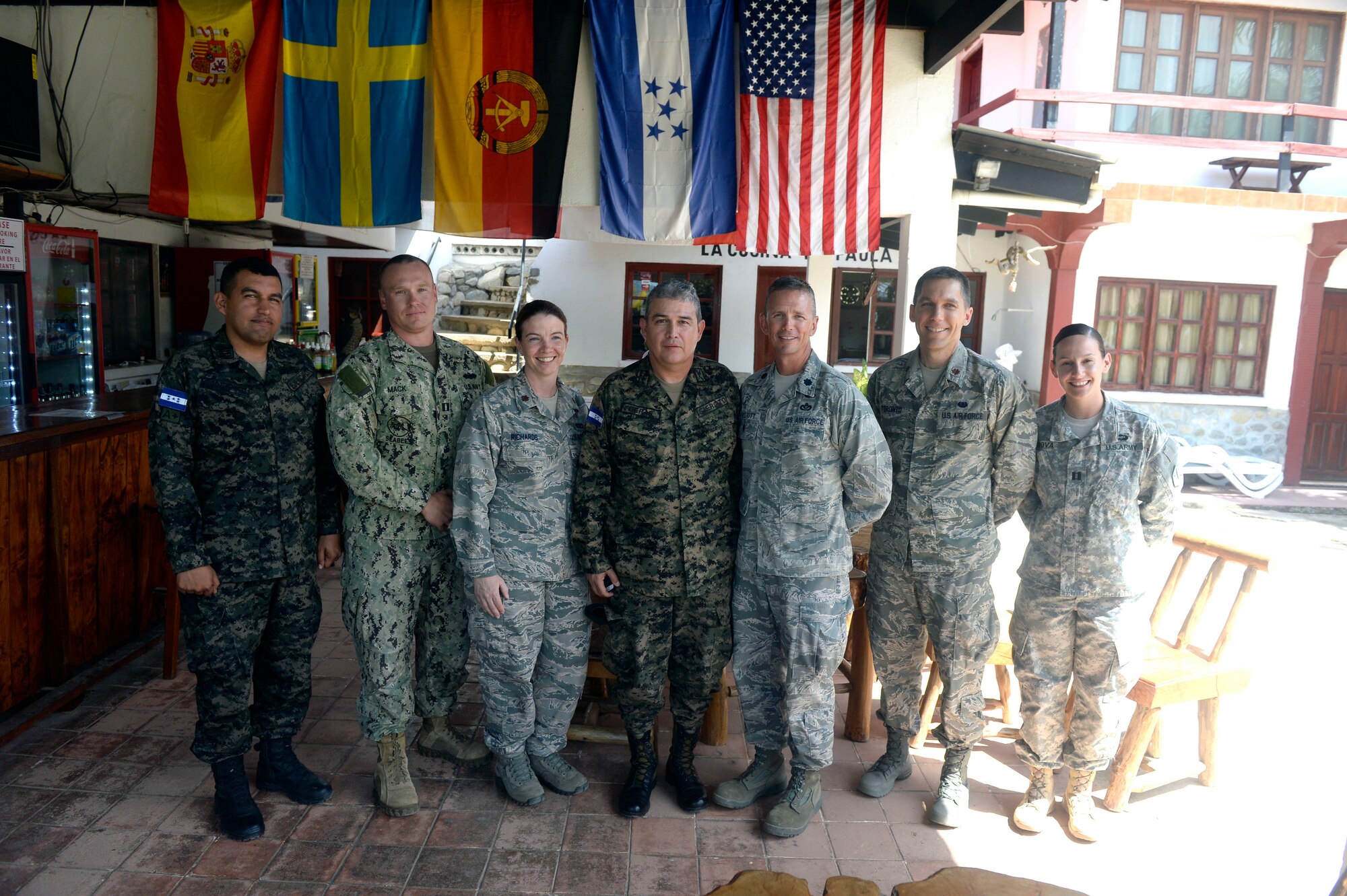 Honduran Army leadership poses with New Horizons Honduras 2015 leadership in a group photo in Trujillo, Honduras, May 30, 2015. New Horizons was launched in the 1980s and is an annual joint humanitarian assistance exercise that U.S. Southern Command conducts with a partner nation in Central America, South America or the Caribbean. The exercise improves joint training readiness of U.S. and partner nation civil engineers, medical professionals and support personnel through humanitarian assistance activities. (U.S. Air Force photo by Capt. David J. Murphy/Released)