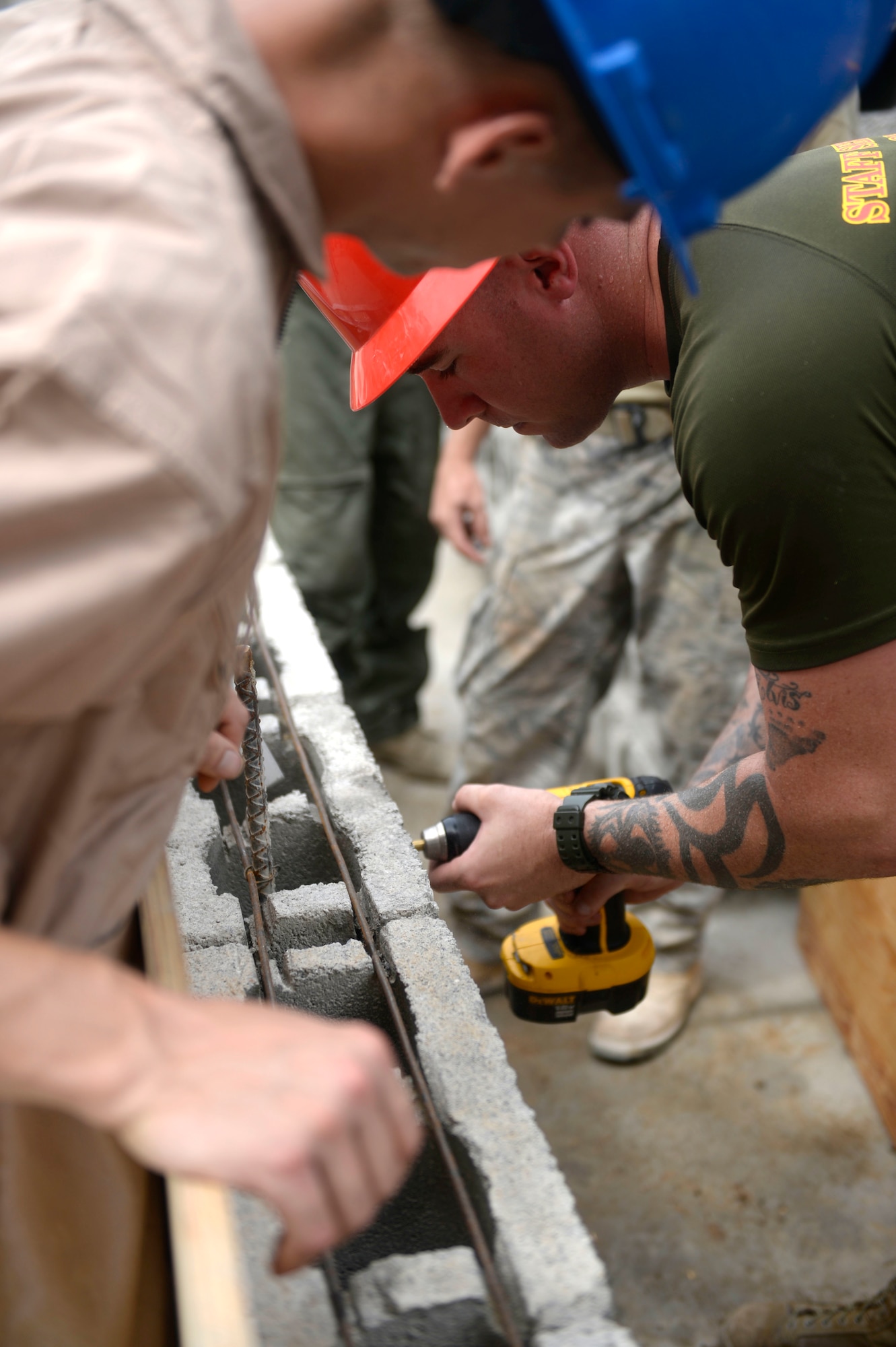 U.S. Marine Corps Sgt. Andrew Smith, a combat engineer with a 271st Marine Wing Support Squadron, 2nd Marine Air Wing, out of Marine Corps Air Station Cherry Point, N.C., builds a form for the windows of the new two-classroom school building at the Gabriela Mistral primary school construction site in Ocotes Alto, Honduras, June 5, 2015. The Marines are working together with the 823rd Expeditionary RED HORSE Squadron out of Hurlburt Field, Fla., to construct a two-classroom school house as part of the New Horizons Honduras 2015 training exercise. New Horizons was launched in the 1980s and is an annual joint humanitarian assistance exercise that U.S. Southern Command conducts with a partner nation in Central America, South America or the Caribbean. The exercise improves joint training readiness of U.S. and partner nation civil engineers, medical professionals and support personnel through humanitarian assistance activities. (U.S. Air Force photo by Capt. David J. Murphy/Released)