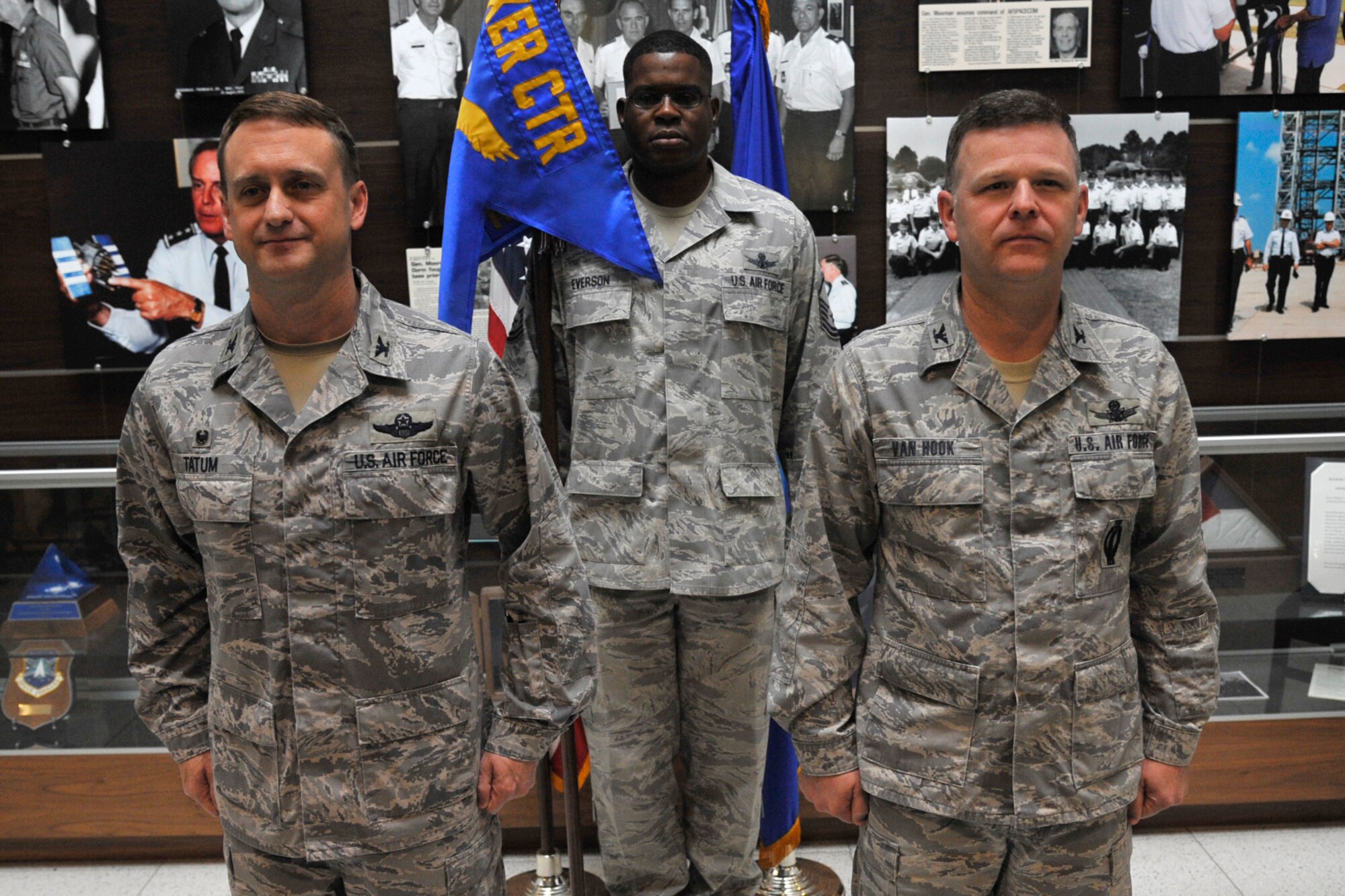 PETERSON AIR FORCE BASE, Colo. – Col. Kenneth Tatum Jr. (left), commander of the Ira C. Eaker Center for Professional Development, Maxwell AFB, Ala., passed the National Security Space Institute's flag to Col. Richard Van Hook during the NSSI assumption of command ceremony June 5 at the Moorman Space Education and Training Center. NSSI provides space education and training to Air Force space professionals and the broader National Security Space community. (U.S. Air Force photo by Robb Lingley)