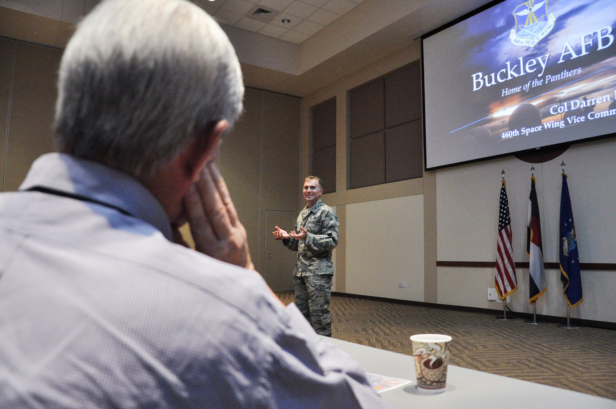 Col. Darren Buck, 460th Space Wing vice commander, engages with members of the 2015 National Conference of State Legislatures June 4, 2015, at Buckley Air Force Base, Colo. The legislators learned about buffer-zone land issues, public-public public-private initiatives, and observed how Buckley AFB is successfully integrating with the State of Colorado to benefit both the base’s and the state’s populations. (U.S. Air Force photo by Tech. Sgt. Nicholas Rau/Released)